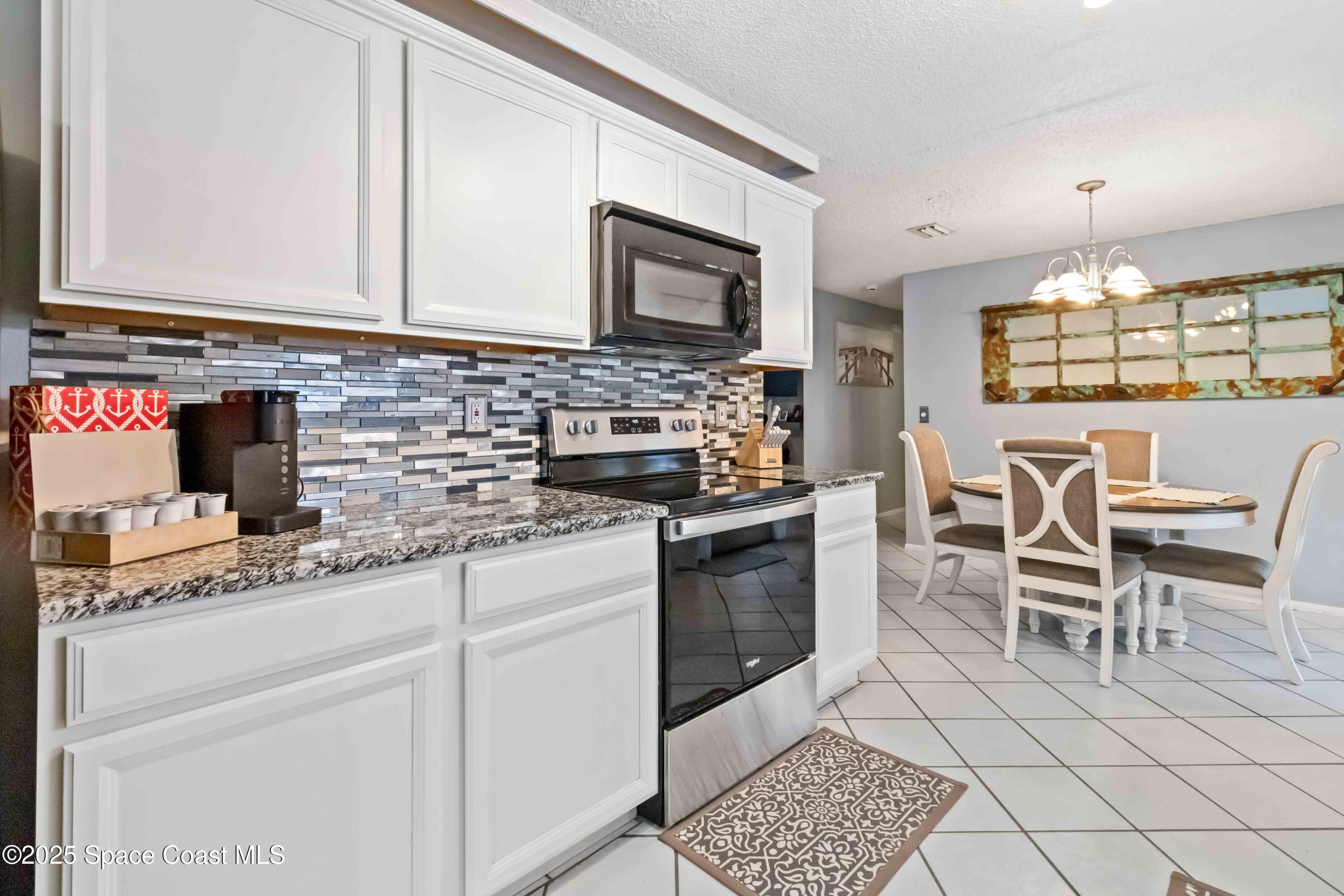 215 Capron Road Cocoa, FL 32927 - Photo 14 of 26 Open To The Dining Room!