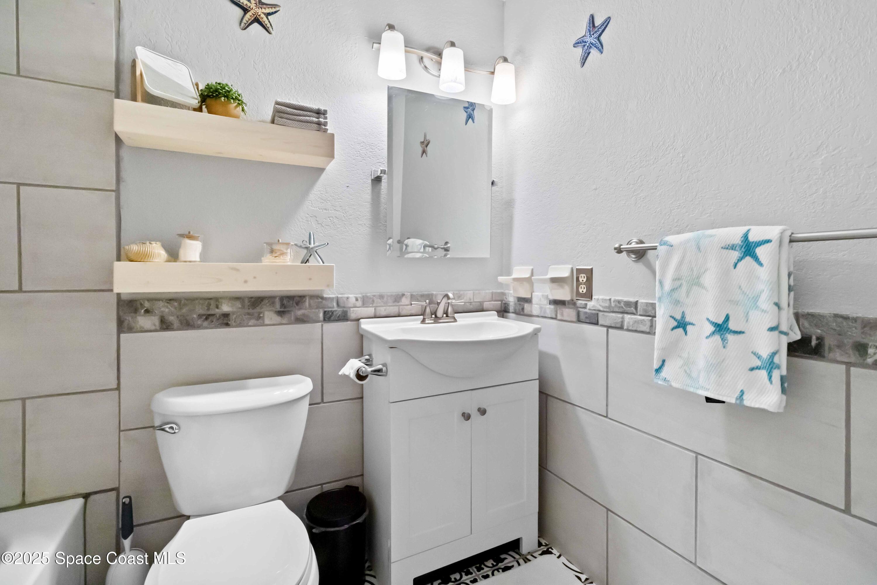 215 Capron Road Cocoa, FL 32927 - Photo 16 of 26 Beautifully Updated Guest Bathroom!