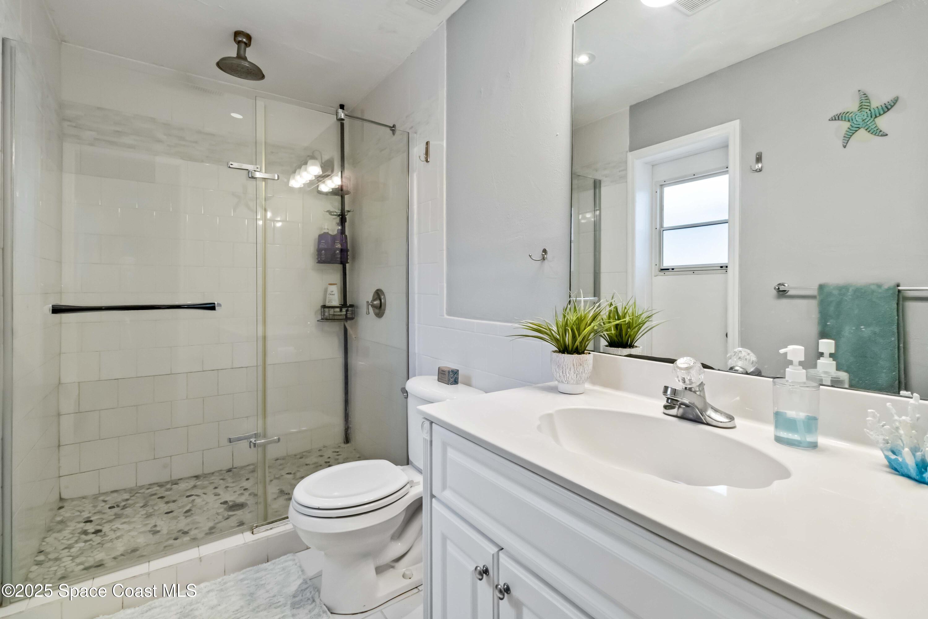 215 Capron Road Cocoa, FL 32927 - Photo 19 of 26 Updated Primary Bath with Pool Door!