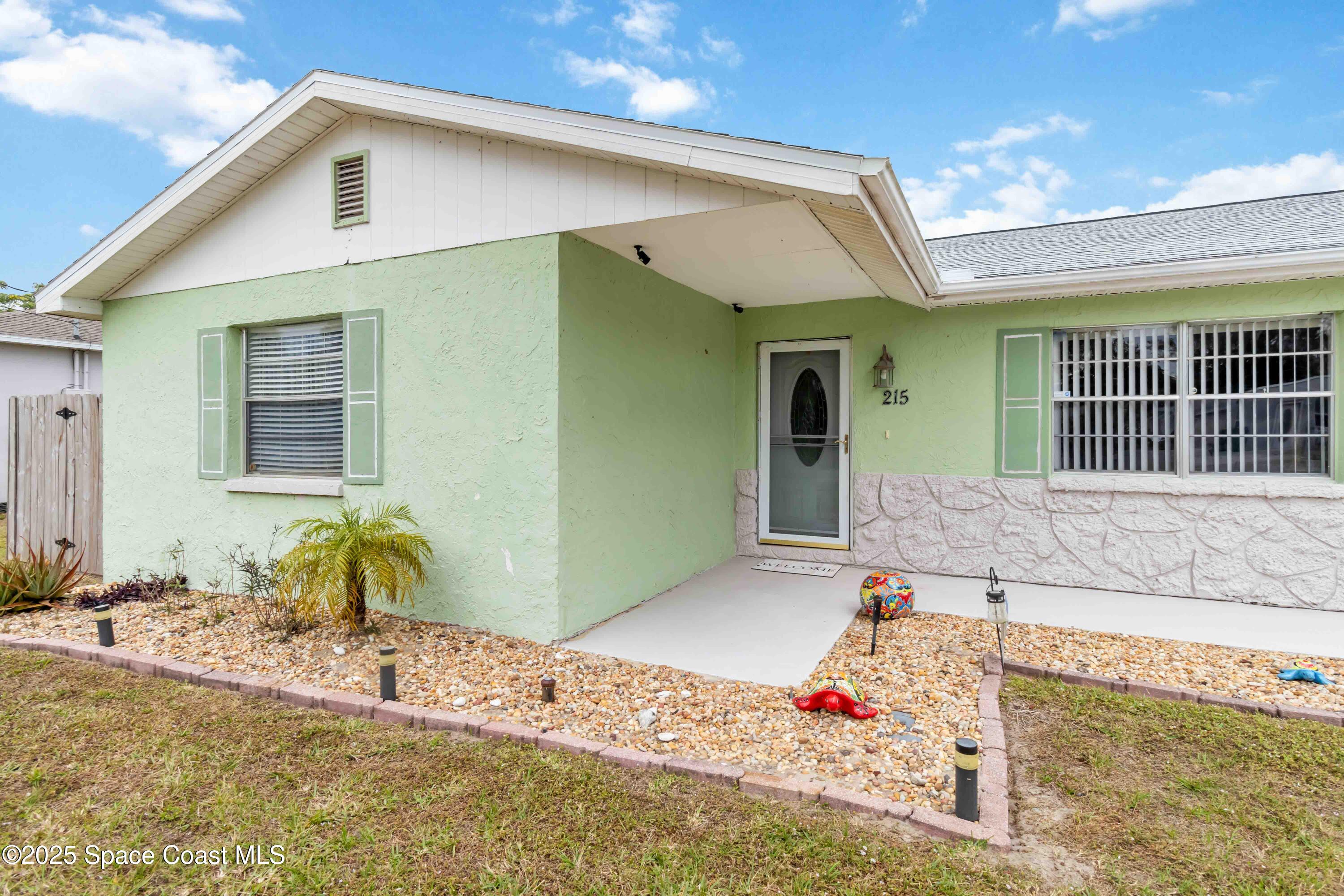 215 Capron Road Cocoa, FL 32927 - Photo 3 of 26 Lush Landscape Greets You!