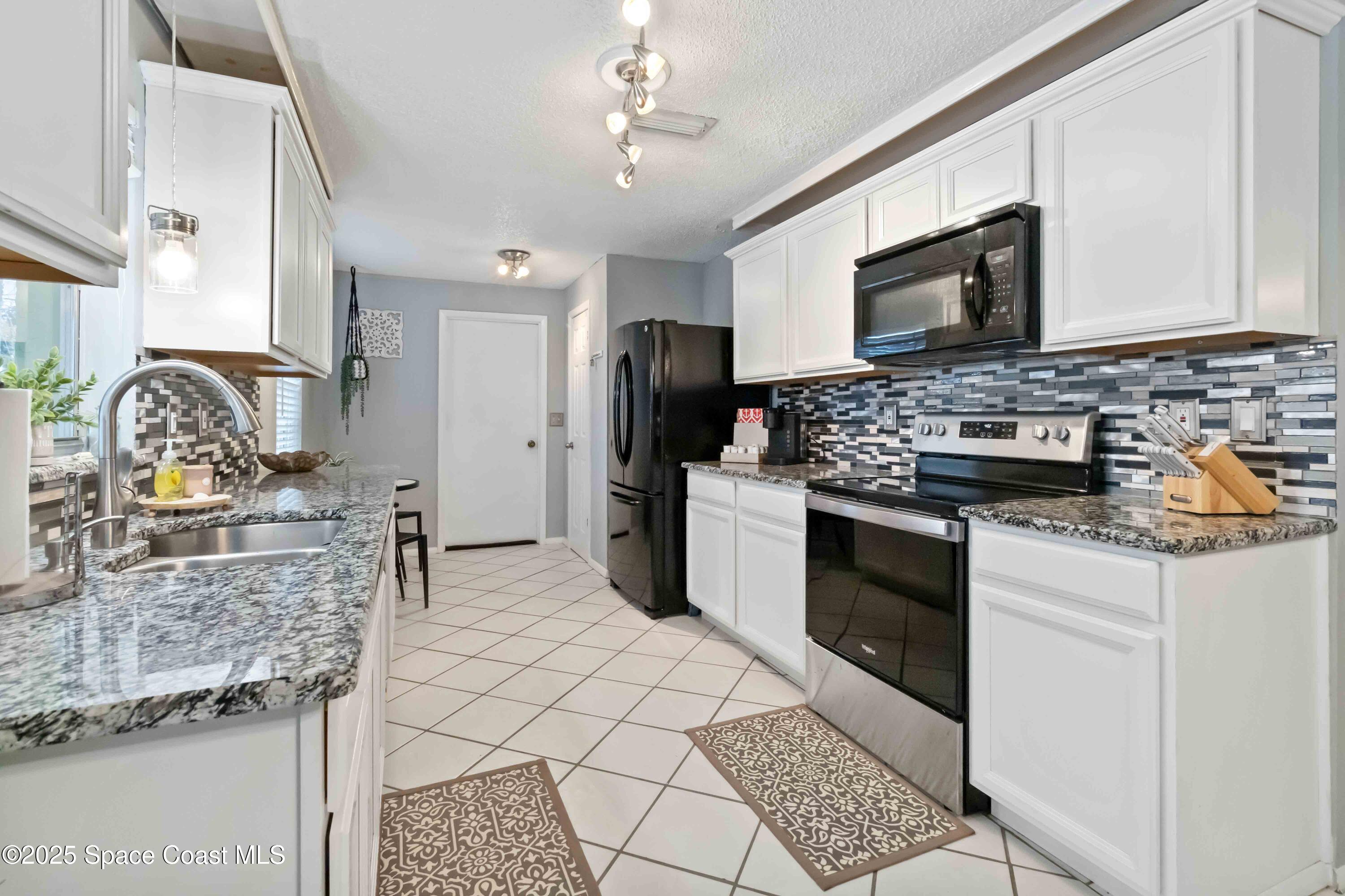 215 Capron Road Cocoa, FL 32927 - Photo 10 of 26 Beautiful Backsplash and Lighting!