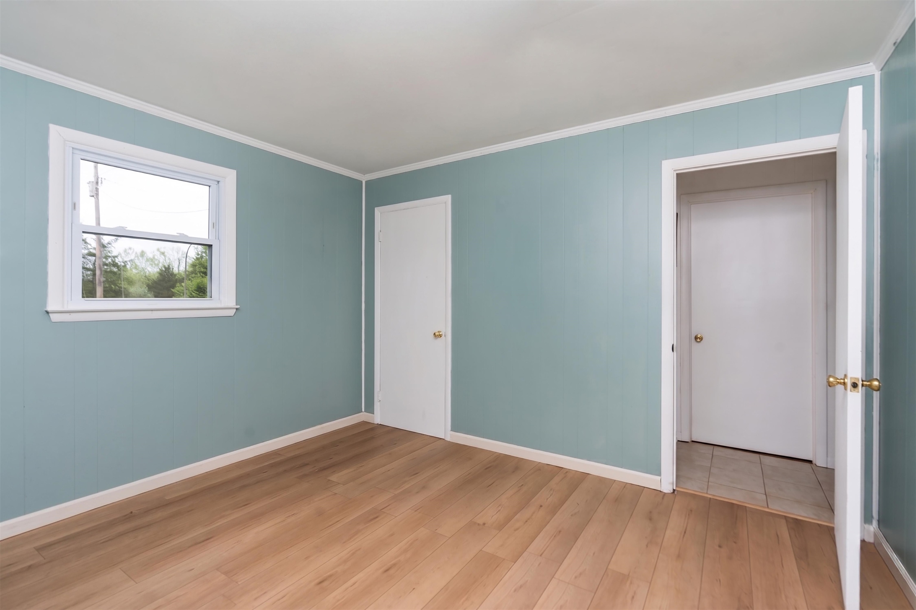 3292 Deerfield Valley Road Deerfield, VA 24432 - Photo 38 of 69 a view of an empty room with wooden floor and a window