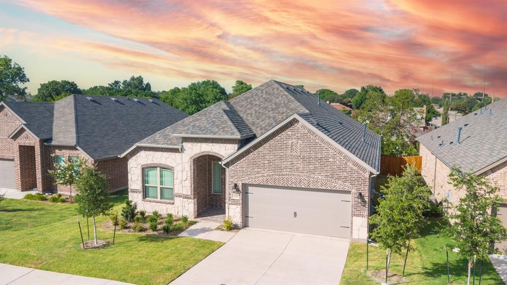 2510 Rockbrook Road Garland, TX 75041 - Photo 2 of 33 front view of a house with a yard