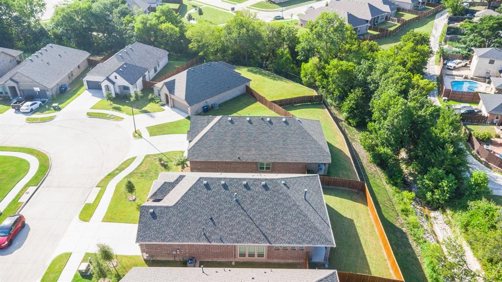2510 Rockbrook Road Garland, TX 75041 - Photo 32 of 33 an aerial view of a house with swimming pool and large trees