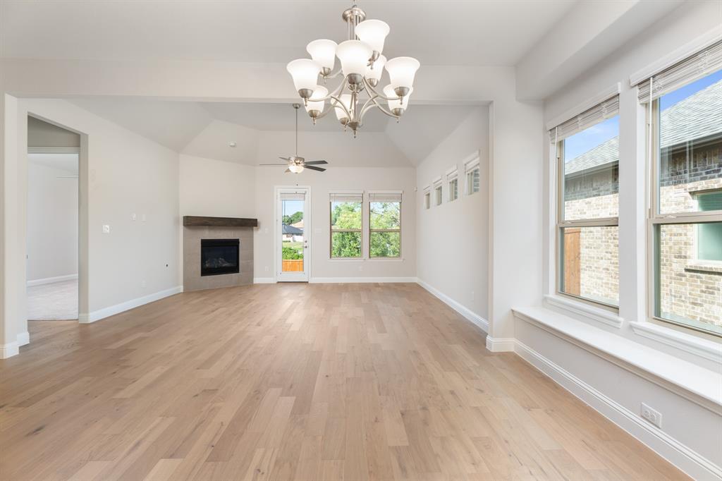 2510 Rockbrook Road Garland, TX 75041 - Photo 7 of 33 a view of an empty room with a window and wooden floor