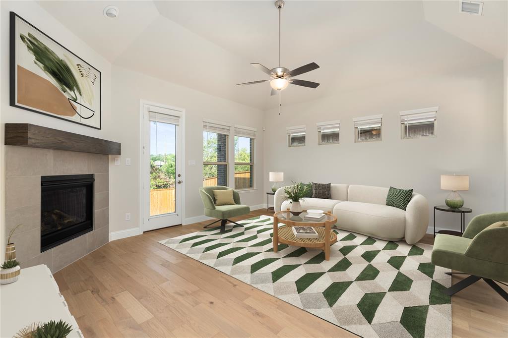 2510 Rockbrook Road Garland, TX 75041 - Photo 8 of 33 a living room with furniture and a fireplace