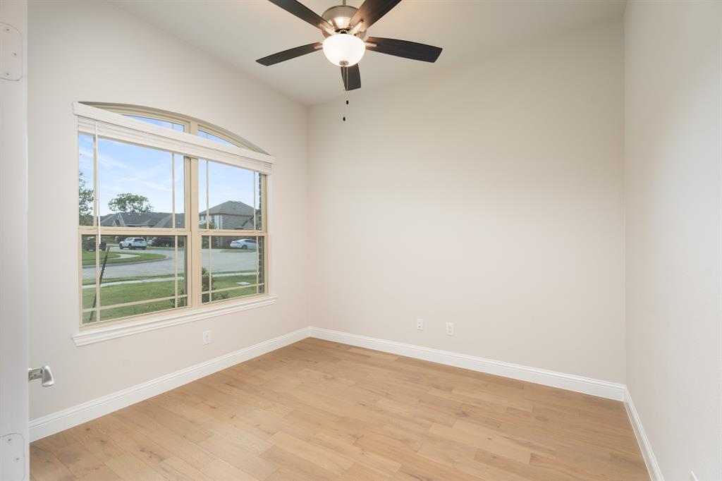 2510 Rockbrook Road Garland, TX 75041 - Photo 10 of 33 an empty room with a window and a fan