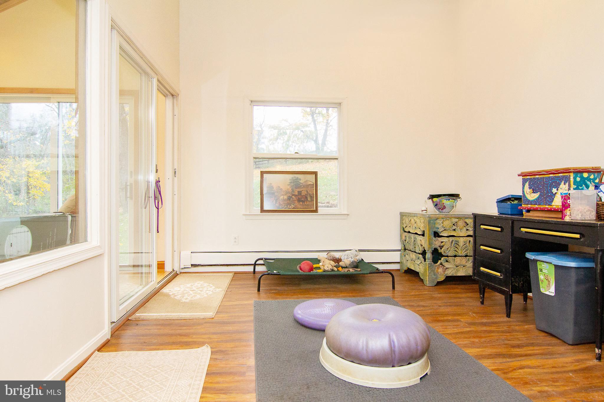 18626 Gunpowder Road Hampstead, MD 21074 - Photo 39 of 66 a living room with furniture and a wooden floor