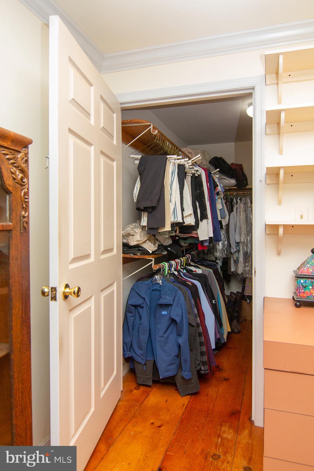 18626 Gunpowder Road Hampstead, MD 21074 - Photo 51 of 66 a view of walk in closet with clothes and shoes
