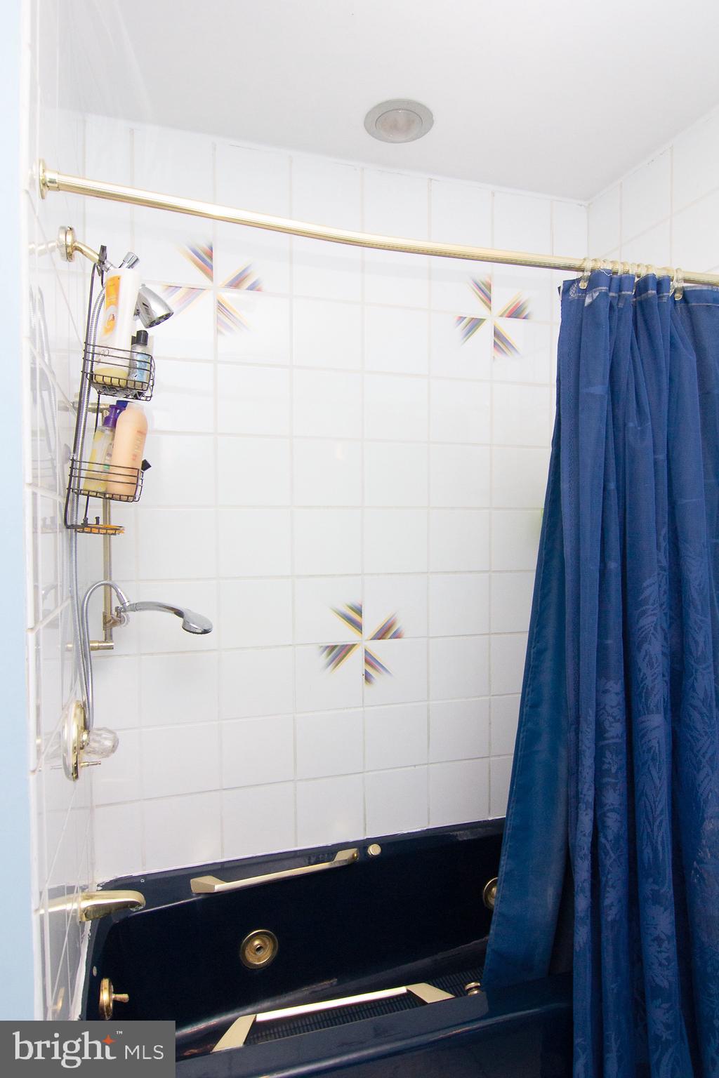 18626 Gunpowder Road Hampstead, MD 21074 - Photo 58 of 66 a bathroom with a shower and a sink