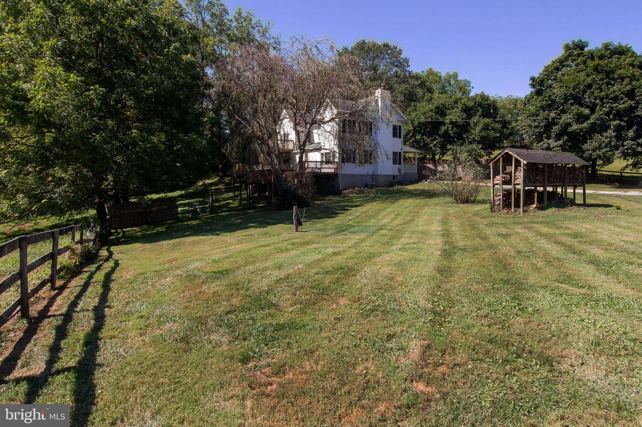 18626 Gunpowder Road Hampstead, MD 21074 - Photo 7 of 66 a view of a backyard with a garden