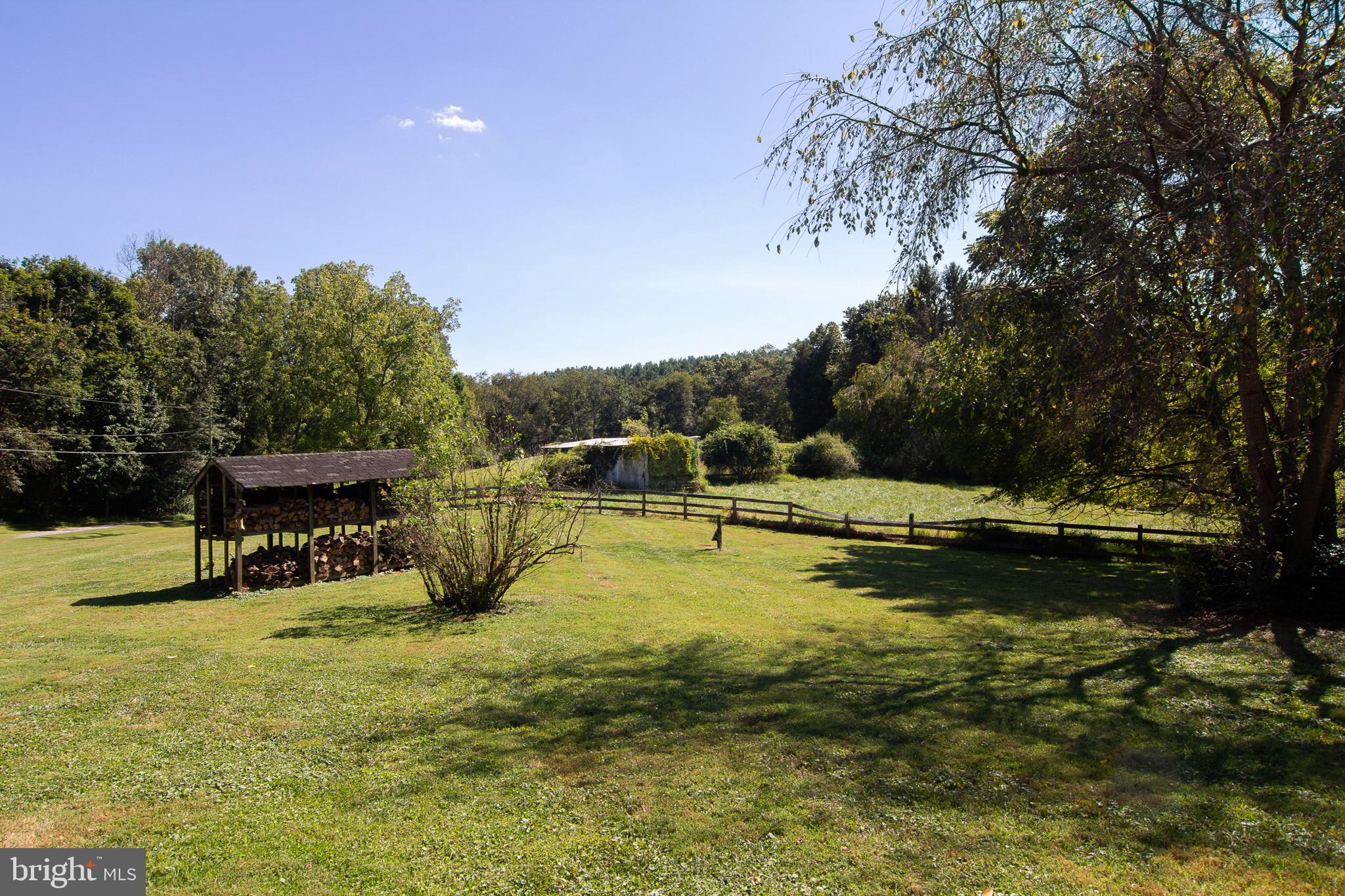 18626 Gunpowder Road Hampstead, MD 21074 - Photo 8 of 66 a view of a swimming pool with an outdoor seating and a yard