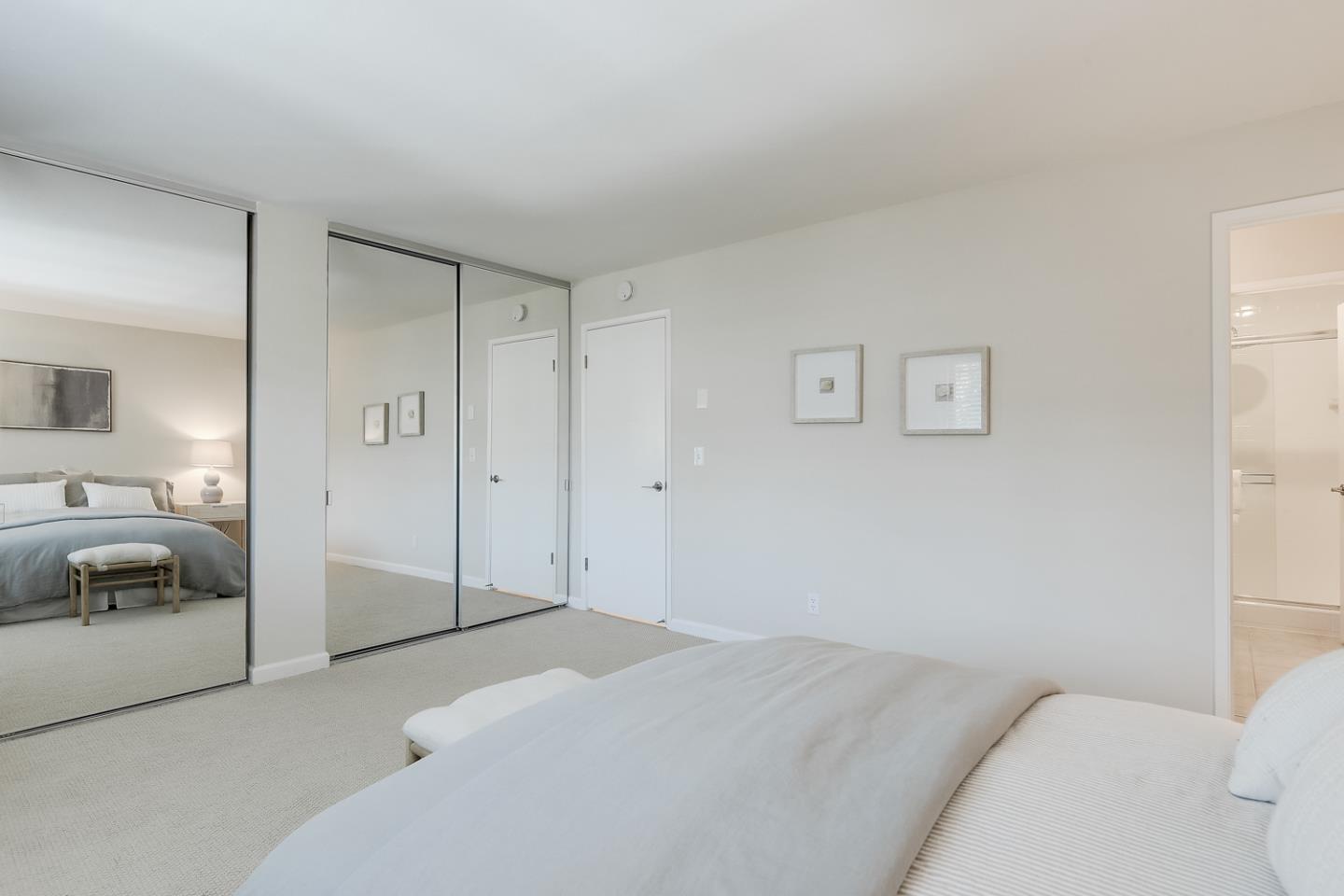 100 East Middlefield Road, Unit 3G Mountain View, CA 94043 - Photo 11 of 22 a bedroom with a bed and a view of bedroom