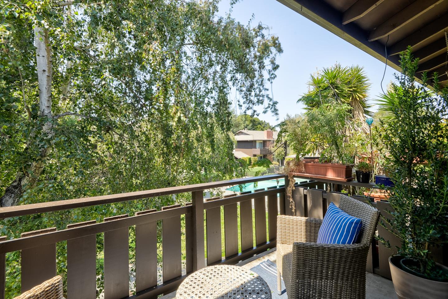 100 East Middlefield Road, Unit 3G Mountain View, CA 94043 - Photo 14 of 22 a view of a chair and table on the deck