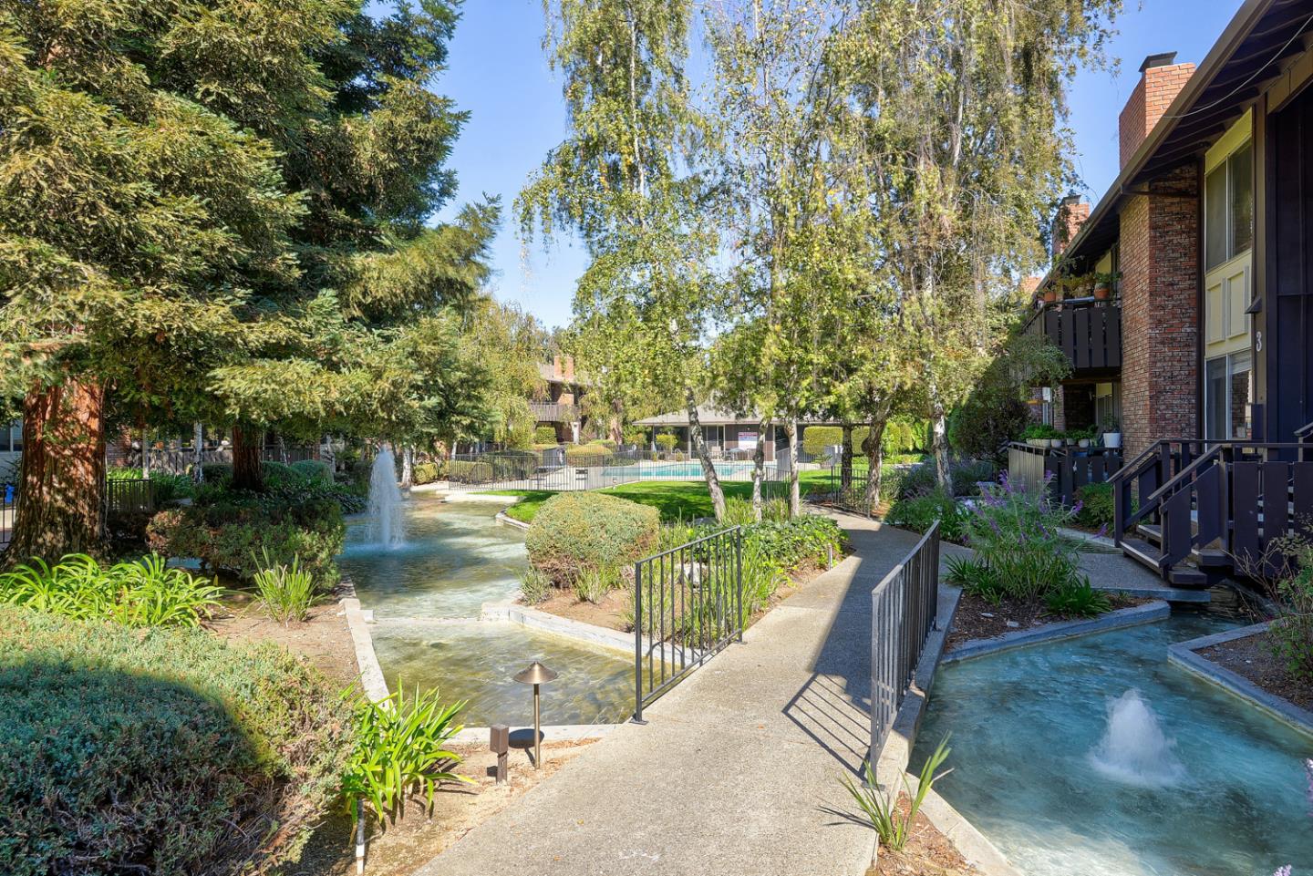 100 East Middlefield Road, Unit 3G Mountain View, CA 94043 - Photo 18 of 22 a view of a lake with a patio