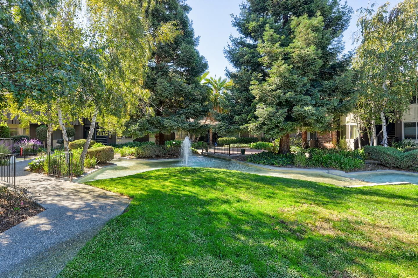100 East Middlefield Road, Unit 3G Mountain View, CA 94043 - Photo 19 of 22 a view of a park with bench and trees