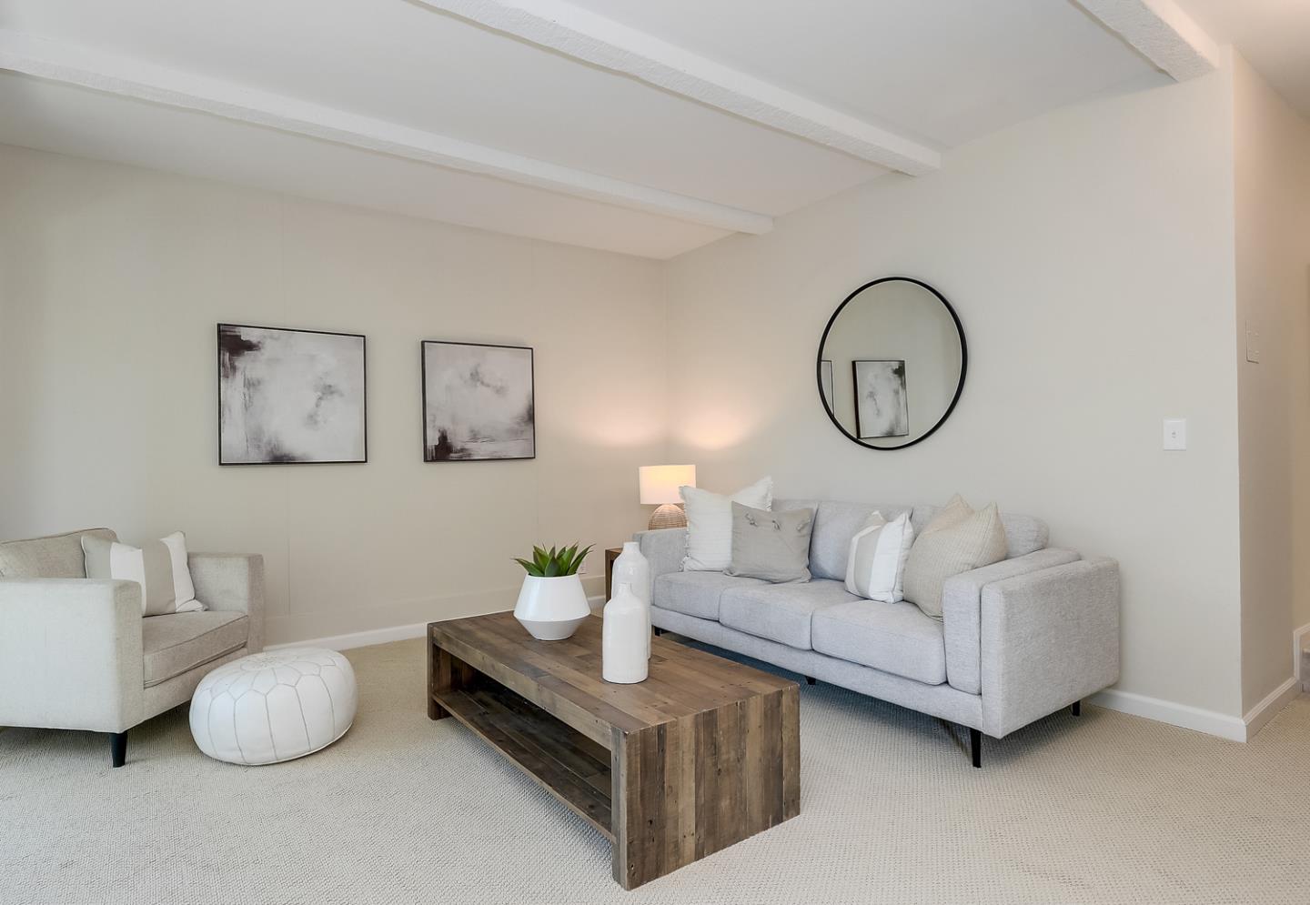 100 East Middlefield Road, Unit 3G Mountain View, CA 94043 - Photo 2 of 22 a living room with furniture a white bedspread and a blue wall
