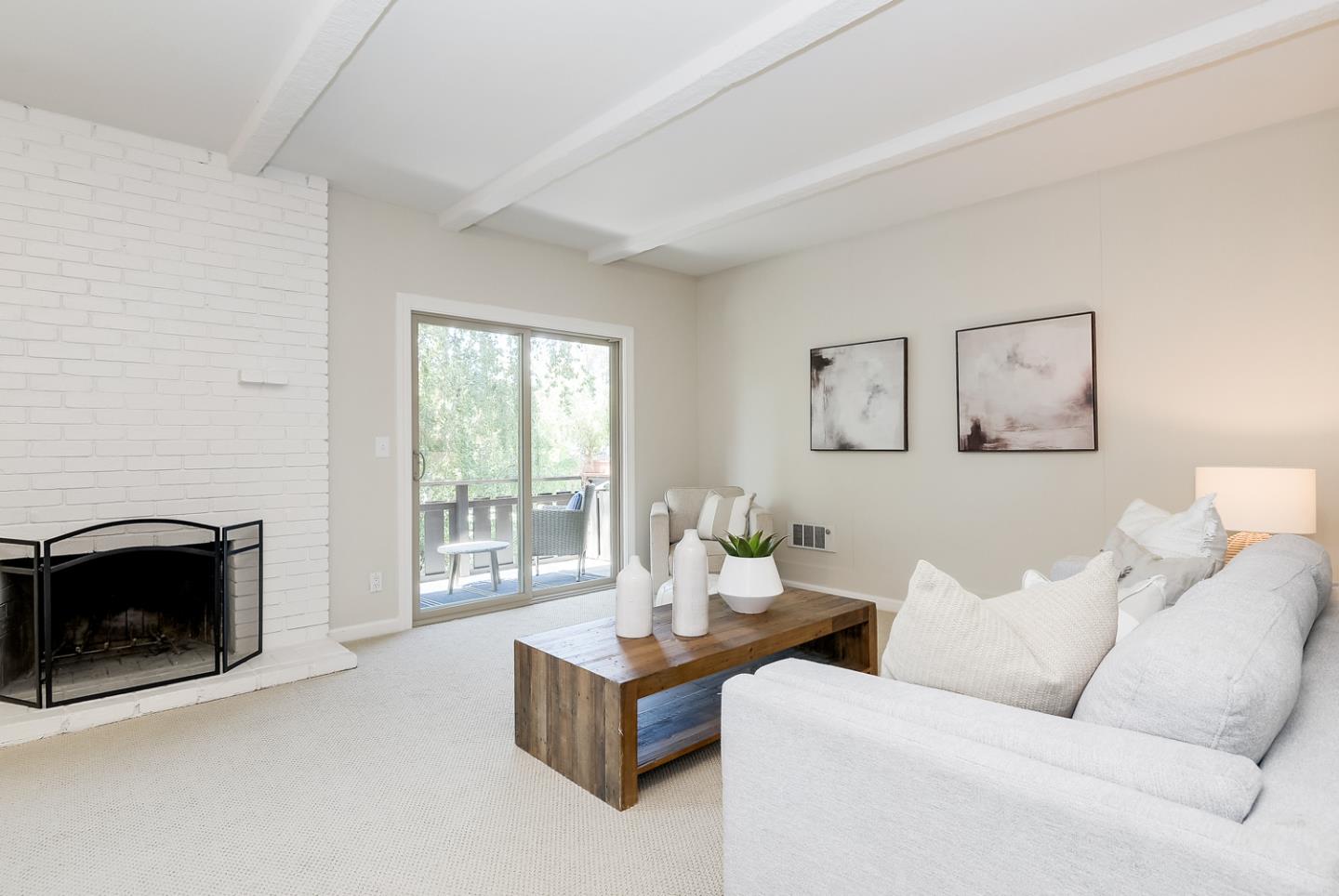 100 East Middlefield Road, Unit 3G Mountain View, CA 94043 - Photo 4 of 22 a living room with furniture and a fireplace