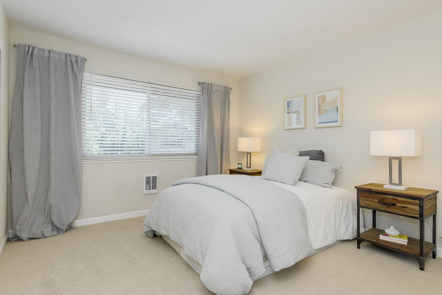 100 East Middlefield Road, Unit 3G Mountain View, CA 94043 - Photo 10 of 22 a bedroom with a bed and a window