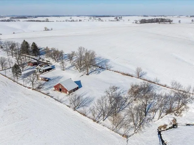 a utility room with a bed and a chandelier