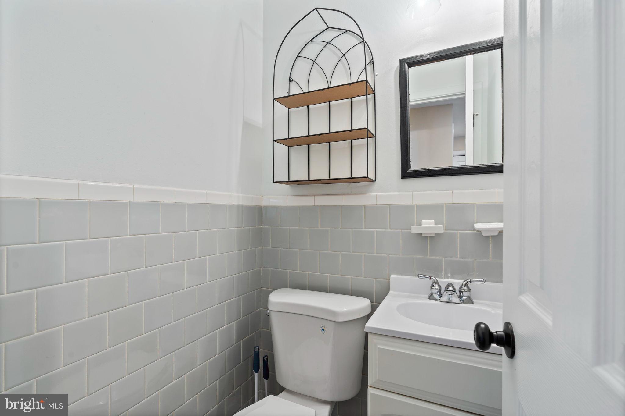 1306 Brixton Road Baltimore, MD 21239 - Photo 19 of 50 Chic bathroom with modern tile accents.