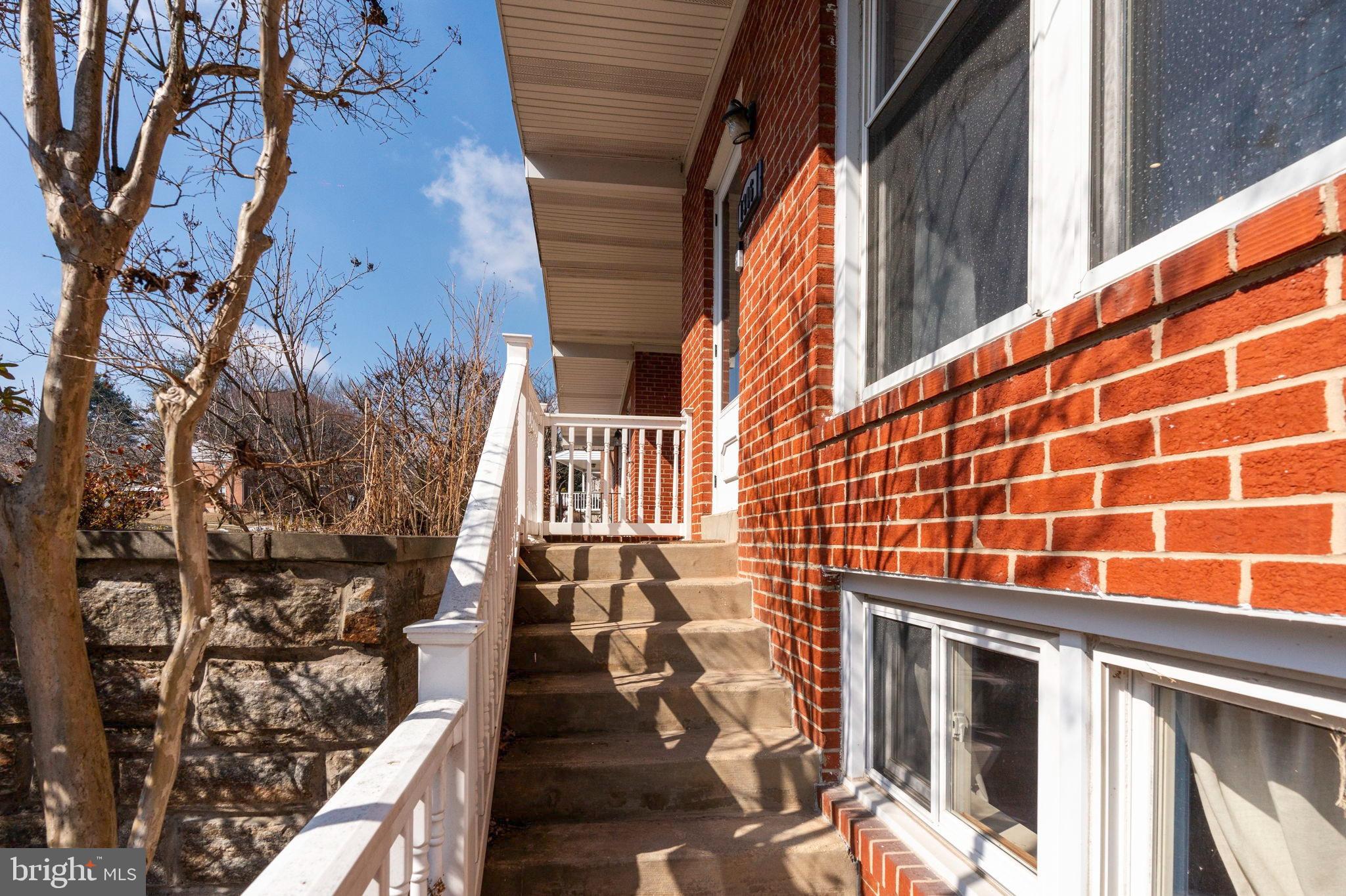 1306 Brixton Road Baltimore, MD 21239 - Photo 2 of 50 Charming brick entrance with inviting steps.