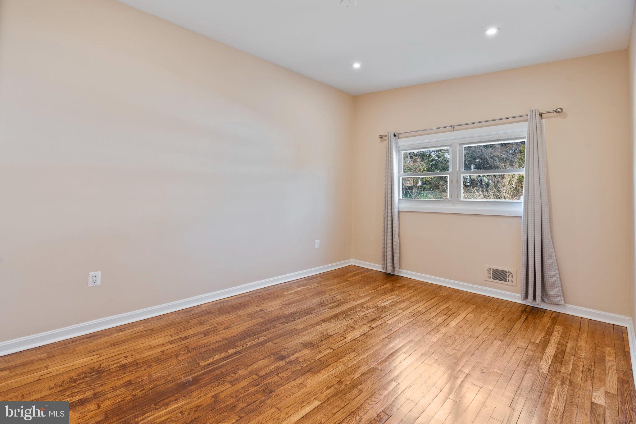 1306 Brixton Road Baltimore, MD 21239 - Photo 27 of 50 Bright and airy space with warm wood floors.