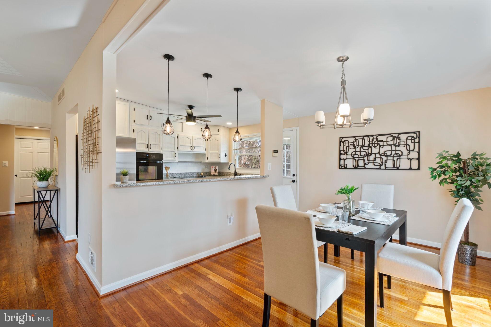 1306 Brixton Road Baltimore, MD 21239 - Photo 4 of 50 Modern dining space with warm wood accents.