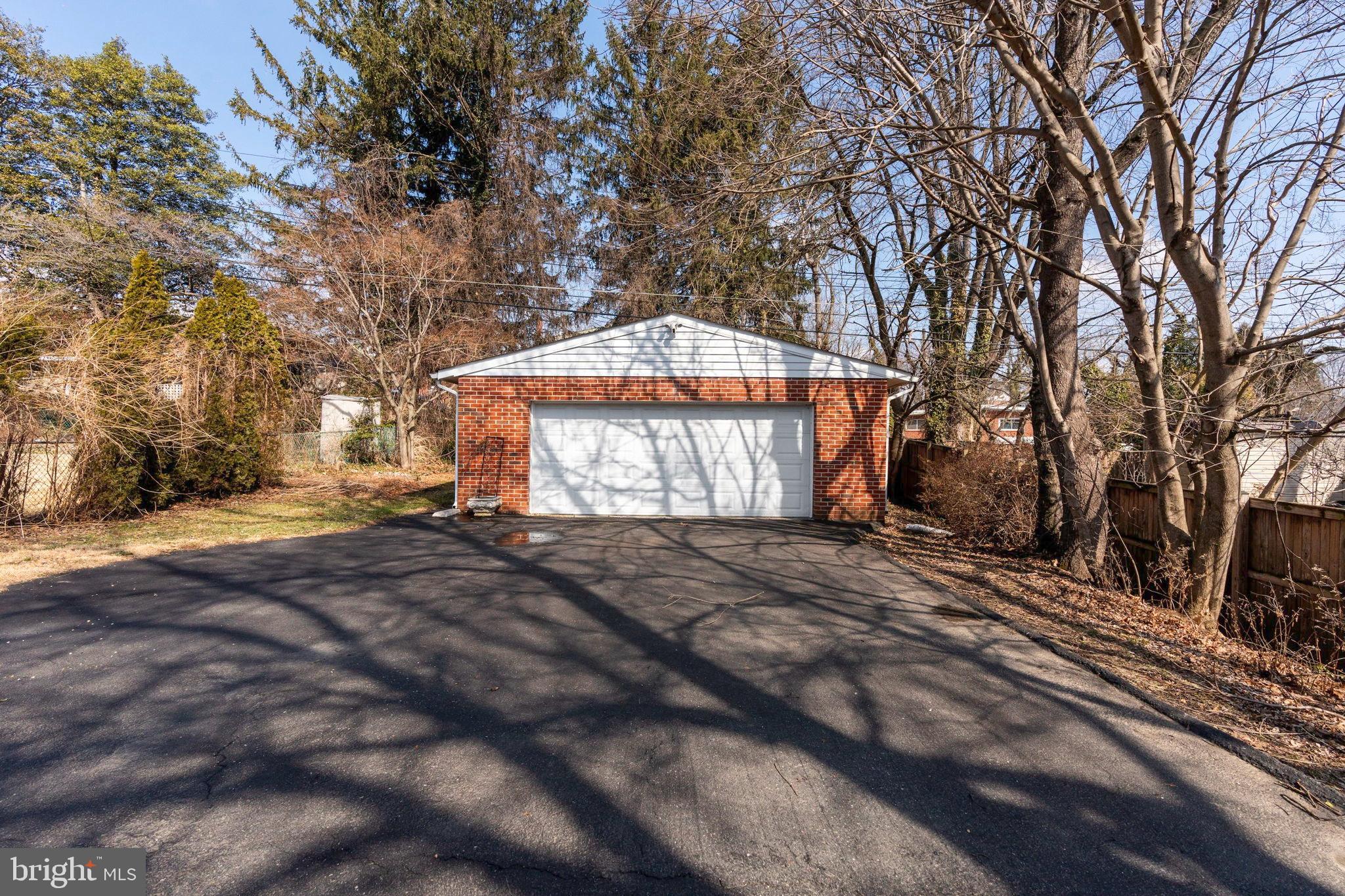 1306 Brixton Road Baltimore, MD 21239 - Photo 42 of 50 Spacious garage nestled among the trees.