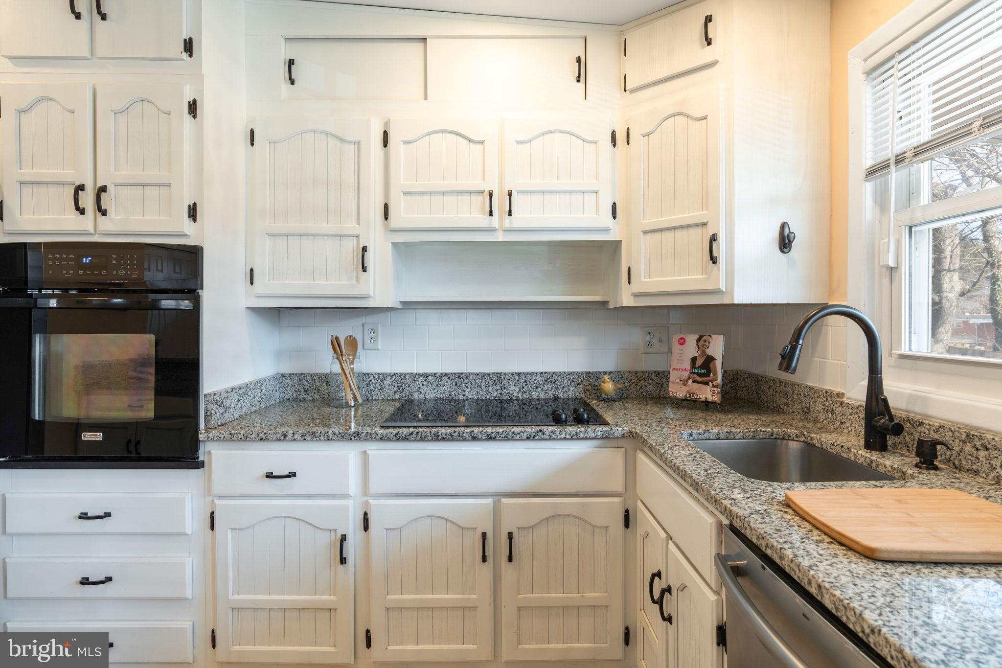 1306 Brixton Road Baltimore, MD 21239 - Photo 10 of 50 Charming kitchen with classic white cabinetry.
