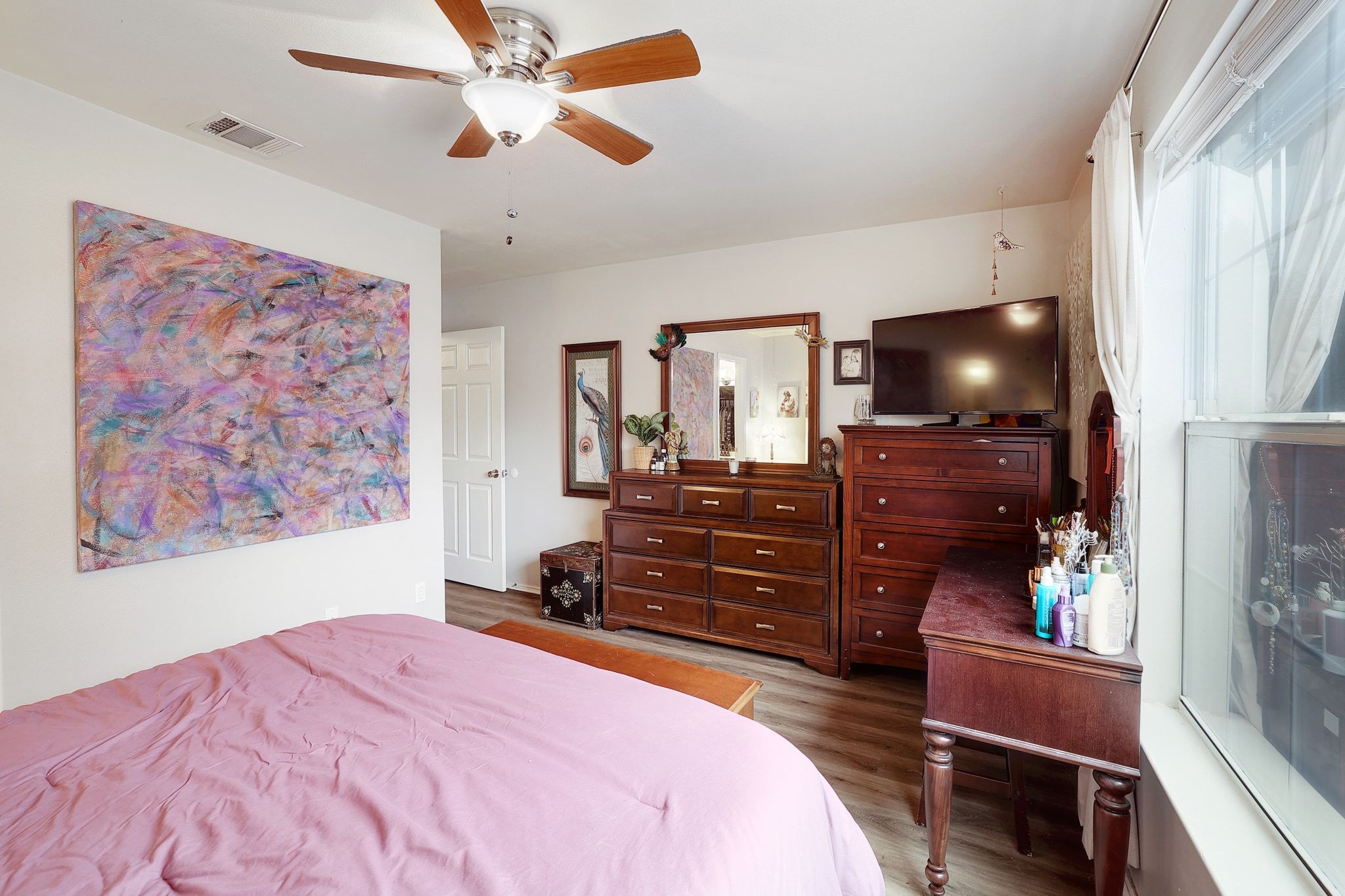 1730 Candee Street Georgetown, TX 78626 - Photo 15 of 26 a bedroom with a bed and a flat screen tv