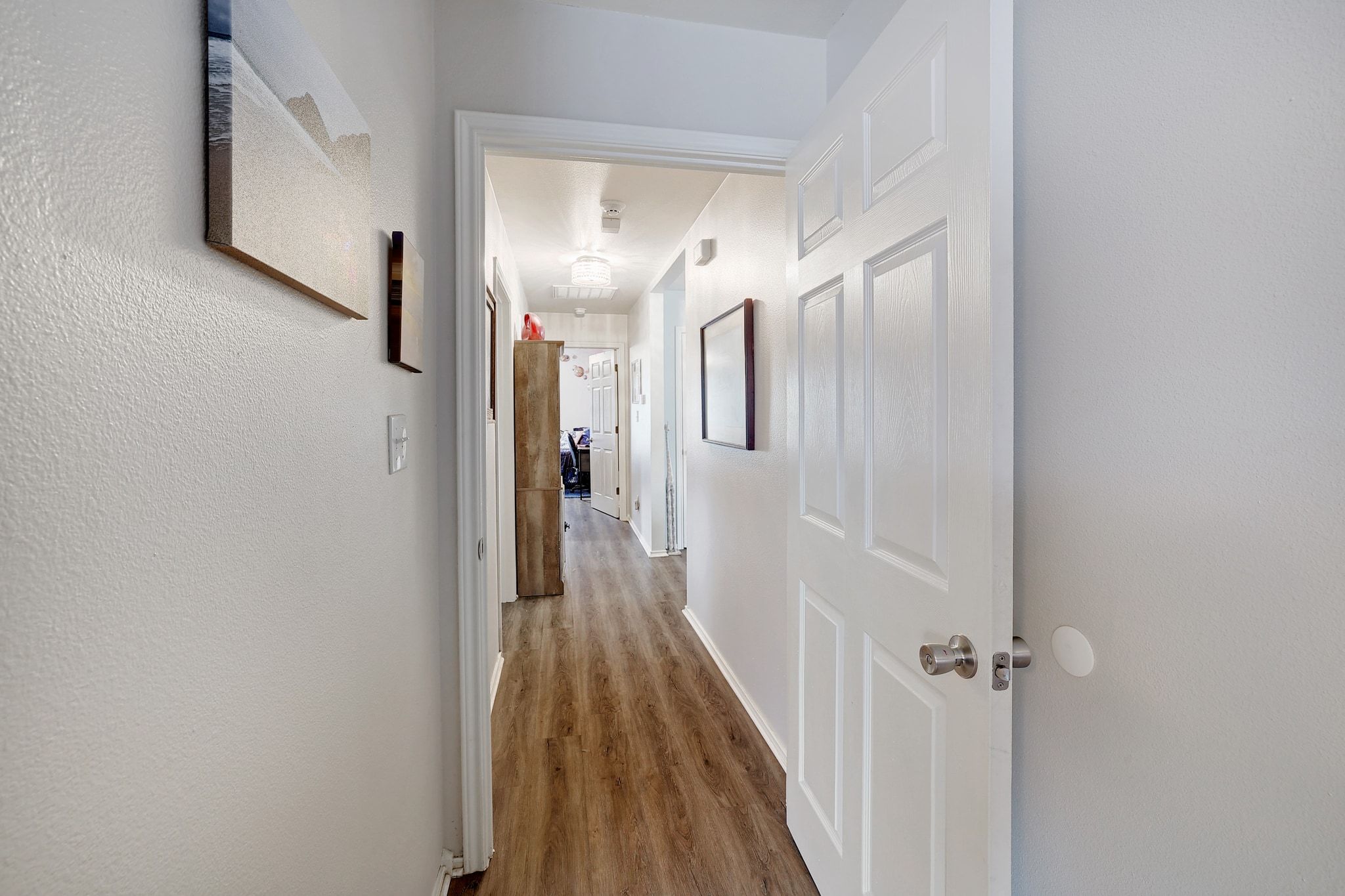 1730 Candee Street Georgetown, TX 78626 - Photo 17 of 26 a view of a hallway with wooden floor and staircase