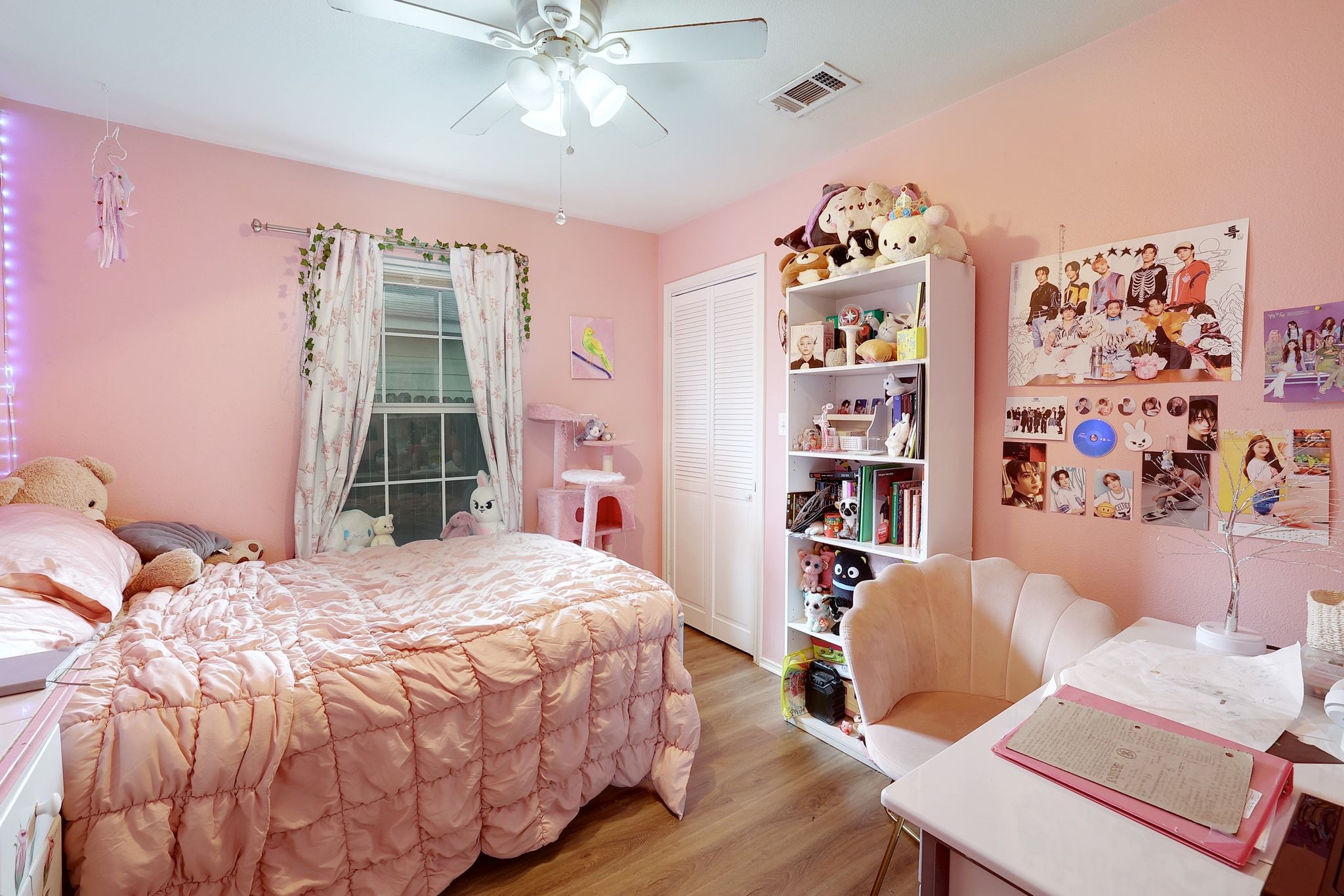 1730 Candee Street Georgetown, TX 78626 - Photo 18 of 26 a bedroom with a bed and a chandelier