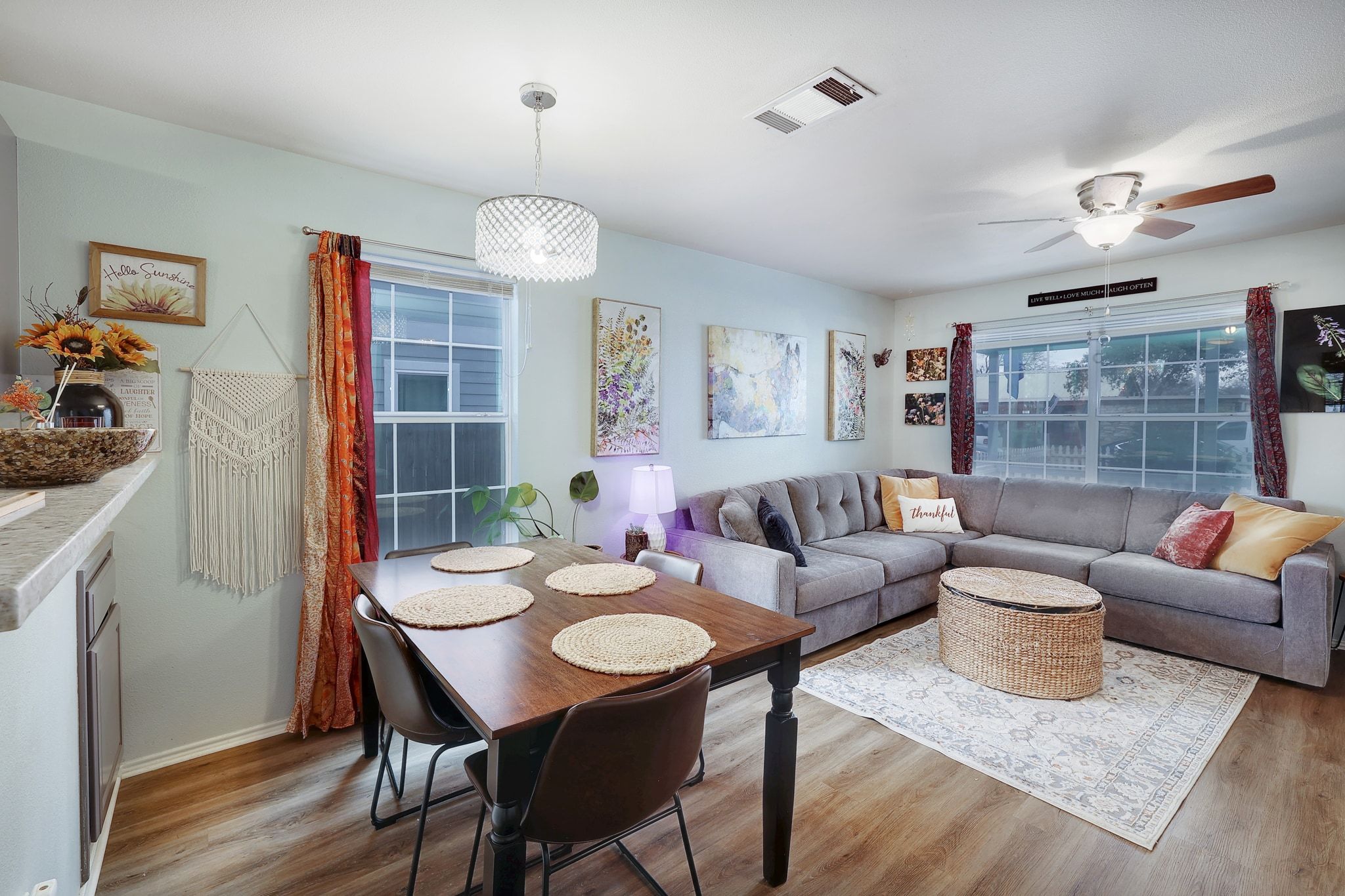 1730 Candee Street Georgetown, TX 78626 - Photo 8 of 26 a living room with furniture a chandelier and a dining table