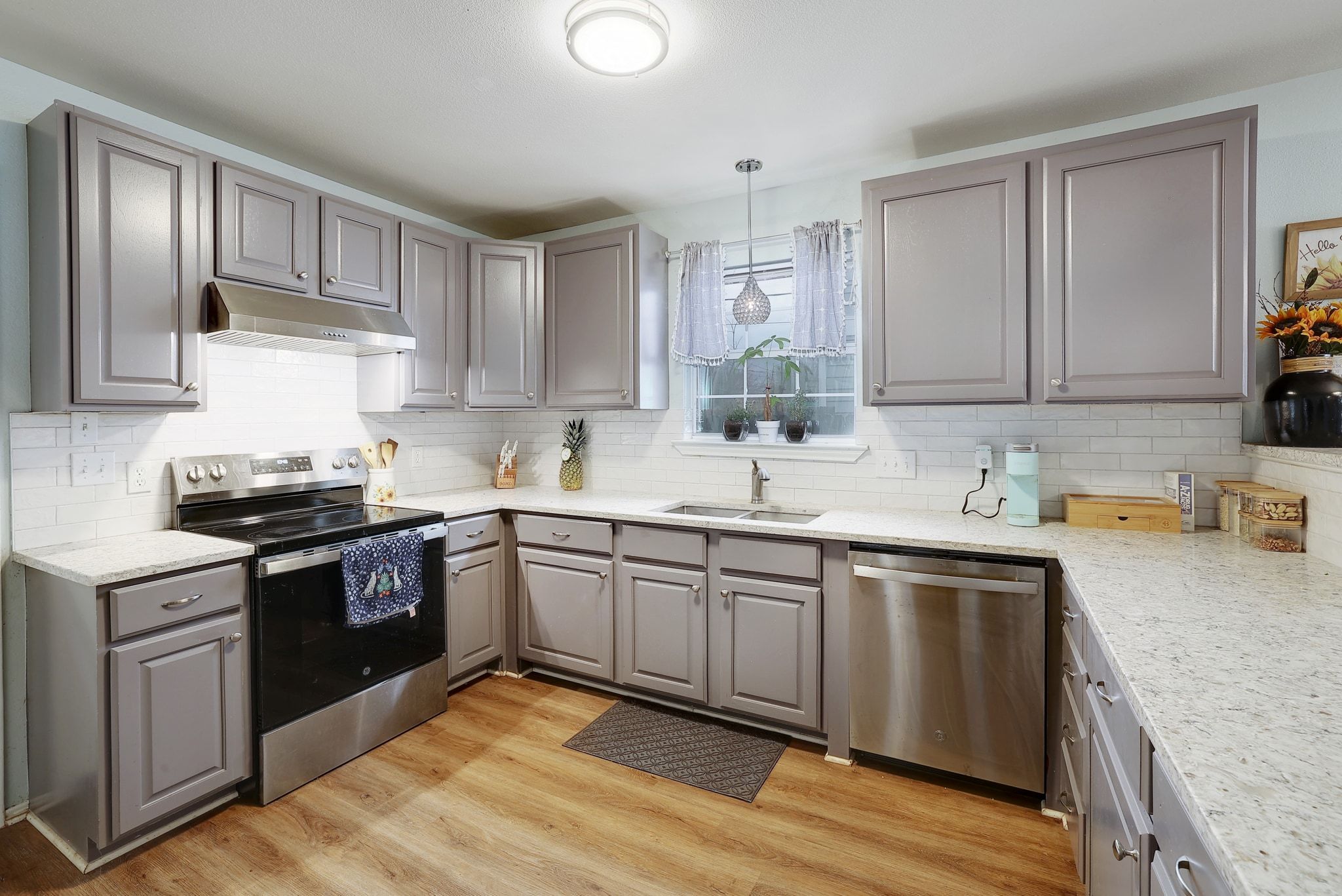 1730 Candee Street Georgetown, TX 78626 - Photo 10 of 26 a kitchen with granite countertop stainless steel appliances and sink