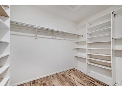 a view of an empty walk in closet