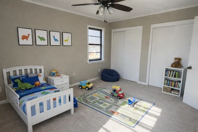 a bedroom with furniture and a chandelier