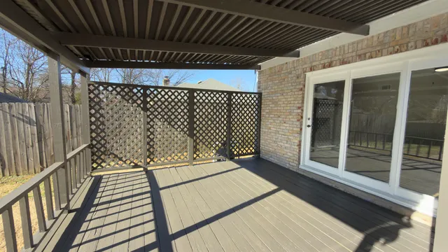 a balcony with wooden floor