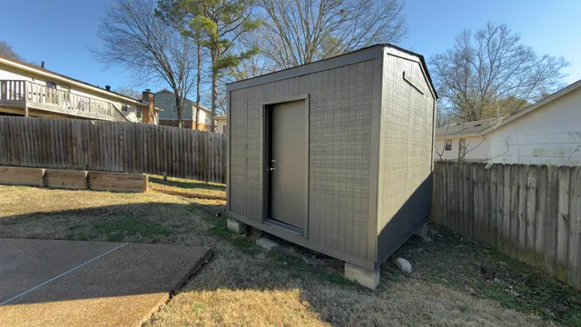 a view of a backyard with a tub
