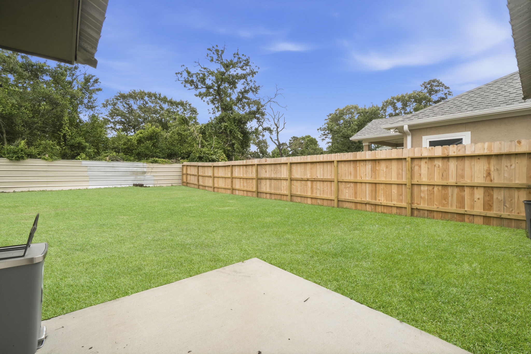 14850 Coaltown Road Willis, TX 77378 - Photo 32 of 41 Enjoy relaxing backyard views from the patio overlooking the large fenced yard and serene natural surroundings.