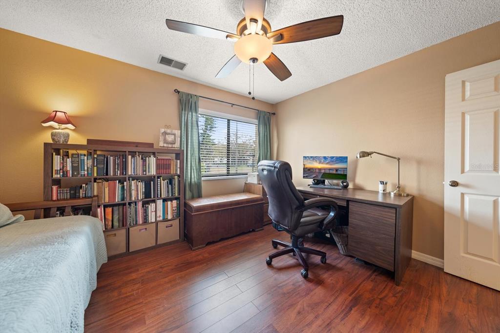 1801 East Lake Road South, Unit 10D Palm Harbor, FL 34685 - Photo 18 of 27 a view of a workspace with furniture and a window