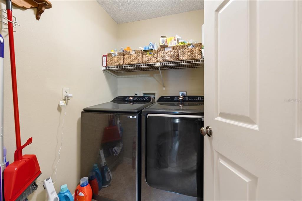 1801 East Lake Road South, Unit 10D Palm Harbor, FL 34685 - Photo 20 of 27 a close view of two washing machine
