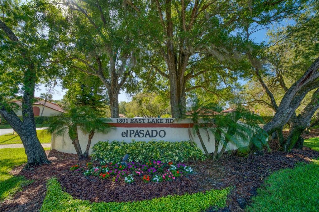 1801 East Lake Road South, Unit 10D Palm Harbor, FL 34685 - Photo 2 of 27 a sign on the side of the road