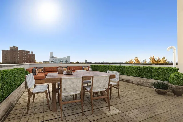 a view of a terrace with furniture and garden