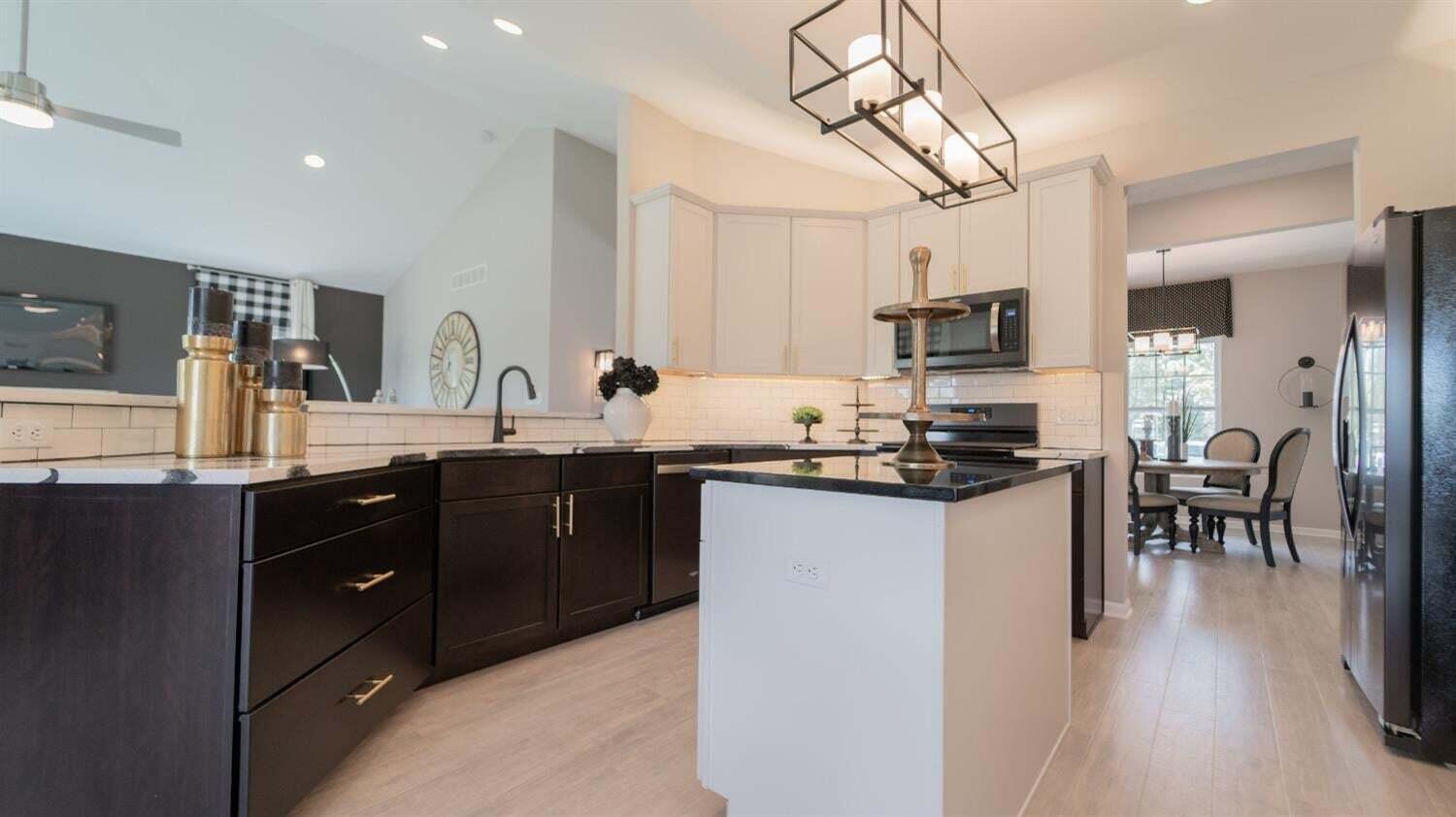 5805 Buck Lane Portage, IN 46368 - Photo 11 of 22 a kitchen with granite countertop a sink appliances and cabinets