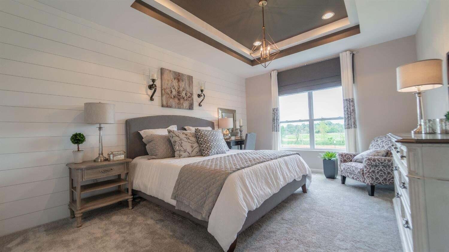 5805 Buck Lane Portage, IN 46368 - Photo 14 of 22 a bedroom with a bed and a lamp on dresser