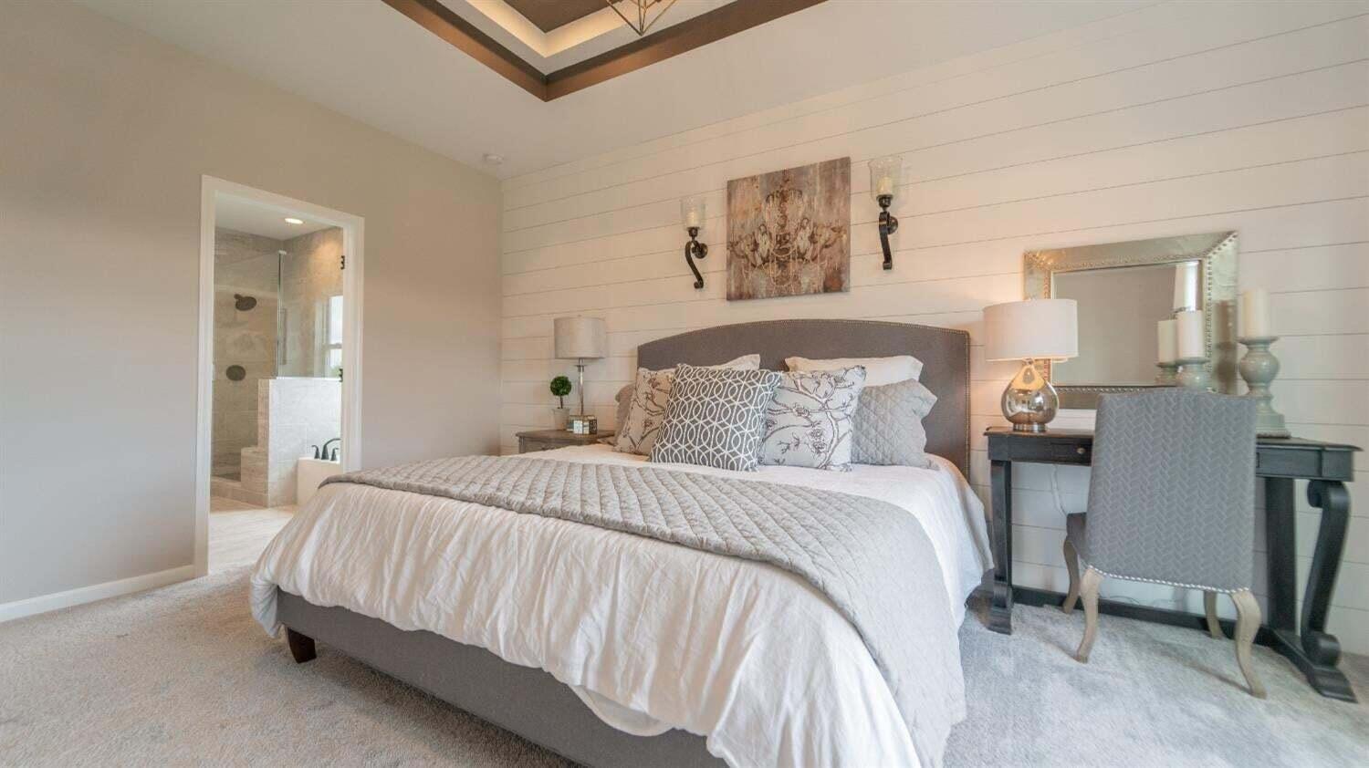 5805 Buck Lane Portage, IN 46368 - Photo 15 of 22 a spacious bedroom with a bed and a desk