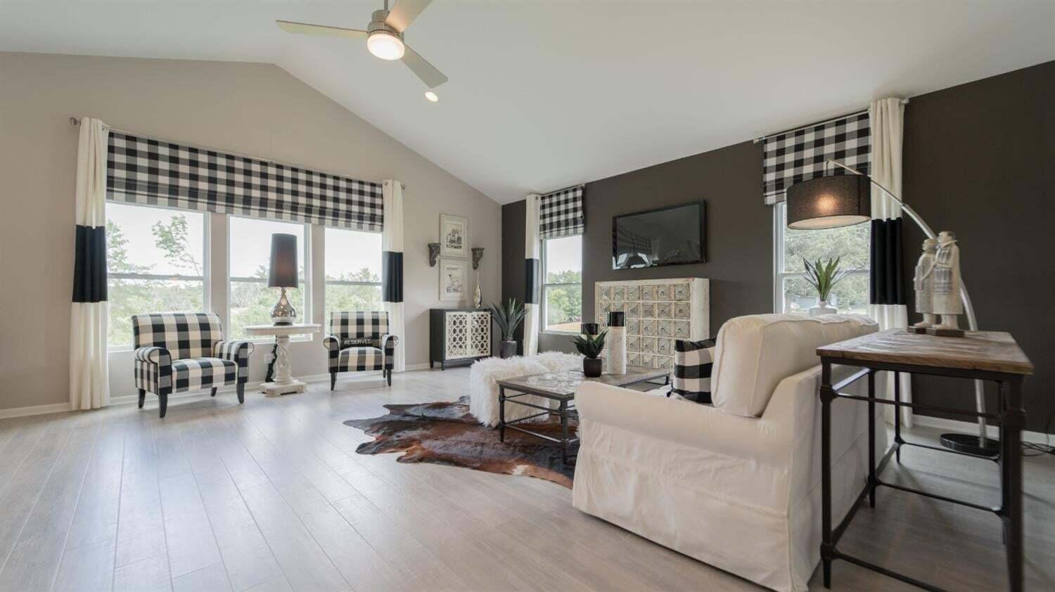 5805 Buck Lane Portage, IN 46368 - Photo 2 of 22 a living room with furniture a fireplace and a flat screen tv