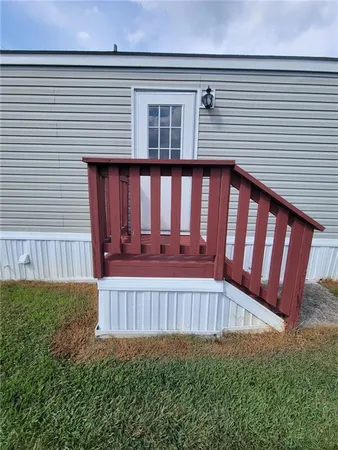 a view of a house with porch and wooden floor