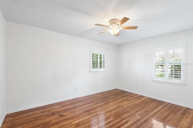 a bathroom with a toilet a sink and a mirror
